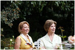 Mrs. Laura Bush talks with Mrs. Kateryna Yushchenko, wife of President Viktor Yushchenko of Ukraine, during a walk through the Rose Garden Monday, Sept. 29, 2008, at the White House.