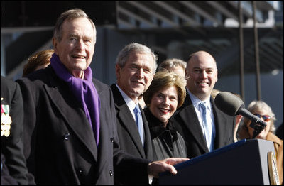 President George W.Bush stands with his father, former President George H.W. Bush and Mrs.Laura Bush during the commissioning ceremony of the USS George H.W. Bush (CVN 77) aircraft carrier Saturday, Jan 10, 2009 in Norfolk, Va.