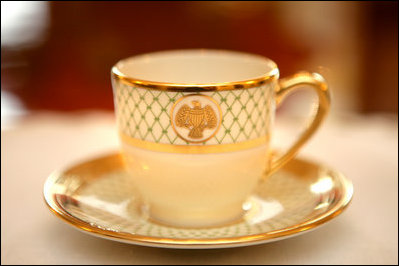 A cup from the George W. Bush State China shows the traditional eagle and the green basket-weave detail that are characteristic of the George W. Bush china unveiled by Mrs. Laura Bush, Wednesday, Jan. 7, 2009 in the Family Dining Room on the State Floor of the White House. The George W. Bush State China was inspired by a Madison-era dinner service. There are 320 place settings of the china with 14 pieces per setting. Although most Americans may use their special service a few times a year, on some days the White House may use the China services several times.