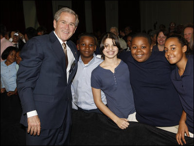 President George W. Bush poses with a group of students Thursday, Jan. 8, 2009, following his address at the General Philip Kearny School in Philadelphia, where President Bush spoke about the success of the No Child Left Behind Act and urged Congress to strenghten and reauthorize the legislation.