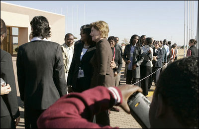 First Lady Laura Bush poses for pictures upon her departure Monday, July 11, 2005 at Gaborone International Airport in Gaborone, Botswana. 