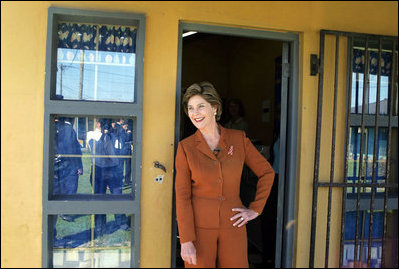 Laura Bush pauses in a doorway during an interview with Ann Curry of The Today Show at Philani, Tuesday July 12, 2005, in Cape Town, South Africa. 