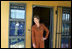 Laura Bush pauses in a doorway during an interview with Ann Curry of The Today Show at Philani, Tuesday July 12, 2005, in Cape Town, South Africa. 