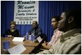 Laura Bush talks with young fathers who have turned their lives around with the help of the Today's Dad program at Rosalie Manor Community and Family Services center in Milwaukee, Wis., Tuesday, March 8, 2005.