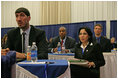 Representatives of the National Basketball Association, former NBA player Gheorghe Muresan, left, NBA players Jerome Vernon WIlliams, background-left, and Detlef Schrempf, background-right, now retired, attend the the White House Conference on Helping America's Youth, Thursday, Oct. 27, 2005 at Howard University in Washington. White House staff member Sonya Medina is seen at right.