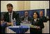 Representatives of the National Basketball Association, former NBA player Gheorghe Muresan, left, NBA players Jerome Vernon WIlliams, background-left, and Detlef Schrempf, background-right, now retired, attend the the White House Conference on Helping America's Youth, Thursday, Oct. 27, 2005 at Howard University in Washington. White House staff member Sonya Medina is seen at right.