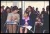 Laura Bush applauds at the end of a reading by renowned children's author and illustrator, Eric Carle, Saturday, October 12, 2002 at the Second Annual National Book Festival on the held on the west side of the Capitol.