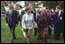 Laura Bush and Ludmila Putina, wife of Russian Federation President Vladimir Putin, stroll across the lawn of the Capitol visiting the tents of authors and story tellers at the Second Annual National Book Festival Saturday, October 12, 2002.