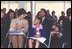 Laura Bush applauds at the end of a reading by renowned children's author and illustrator, Eric Carle, Saturday, October 12, 2002 at the Second Annual National Book Festival on the held on the west side of the Capitol. White House photo by Susan Sterner. 