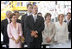 Laura Bush stands next to President Vicente Fox and his wife Marta Sahagun de Fox of Mexico during the inaugural ceremony of President Oscar Arias at the Estadio Nacional in San Jose, Costa Rica, Monday, May 8, 2006.