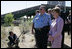 Mrs. Laura Bush surveys the wreckage of the I-35W bridge collapse with Deputy Chief of Police Robert "Rob" Allen in Minneapolis, Friday,Aug. 3, 2007. Mrs. Bush also visited an Emergency Operation Command Center and met with volunteers and first responders.