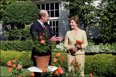 Mrs. Laura Bush smiles at Bill Williams, President and CEO of Harry & David Holdings, Monday, October 2, 2006, as she participates in a ceremony for the unveiling of the Laura Bush rose in The First Lady’s Garden at The White House. Founded in 1872, Jackson & Perkins is a leading hybridizer of garden roses and has launched The Laura Bush rose as part of the First Ladies Rose Series. The rose is a floribunda rose and has light yellow buds that open to a smoky coral color with yellow on the reverse petal. White House photo by Shealah Craighead 