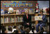 Mrs. Laura Bush, joined by U.S. Secretary of Education Margaret Spellings, reads to children at the Driggs School in Waterbury, Conn., Tuesday, July 24, 2007. Mrs. Bush also announced the 2007 Improving Literacy through School Libraries grants being awarded by the U.S. Department of Education.