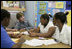 Mrs. Laura Bush talks with students during her tour of the New Orleans Charter Science and Mathematics High School Thursday, April 19, 2007, in New Orleans, La.