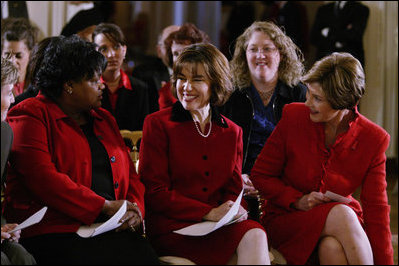 Laura Bush sits with Department of Health and Human Services Acting Assistant Secretary for Health Dr. Cristina Beato, center, and heart attack survivor Joyce Cullen, left, during White House ceremonies to launch American Heart Monday, Monday, Feb. 2, 2004. 