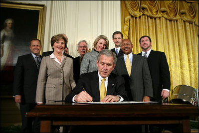 President George W. Bush signs an Executive Order establishing the Interagency Working Group on Youth Programs at the Helping America's Youth Event Thursday Feb. 7, 2008, in the East Room of the White House. The Executive Order is a coalition of Federal agencies that will help support communities and organizations working to help our Nation's youth.