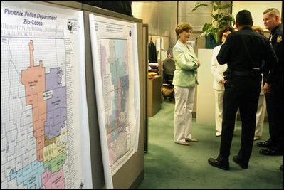  Mrs. Laura Bush pauses to talk with Phoenix Police officers Friday, May 25, 2007, after stopping at the Childhelp Children's Advocacy Center during her Southwest visit.