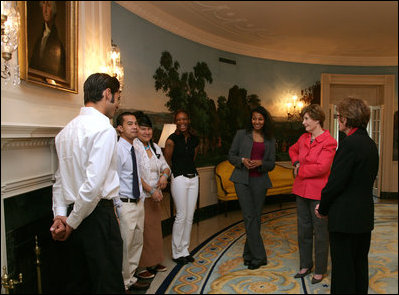 Mrs. Laura Bush talks with recipients of the 2007 Corps Member of the Year Award at the White House on Monday, Feb. 12, 2007. As part of the Helping America's Youth Initiative, The Corp Network engages disadvantaged youth in education, career preparation and life skill development and honors youth who become involved in their communities, overcome adversity, and become role models for America's young people.