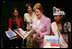 Mrs. Laura Bush looks over reading materials on display Friday, Aug. 3, 2007, at the various information and educational booths of the Saint Paul Community Partnerships Serving American Indian Youth at the Helping AmericaÕs Youth Fourth Regional Conference in St. Paul, Minn. White House photo by Chris Greenberg