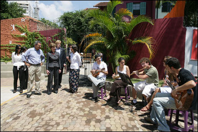 Mrs. Laura Bush listens to a musical performance at Projecto Aprendiz Friday, March 9, 2007, in Sao Paulo, Brazil. Developing the concept of the neighborhood as a school, the program supplements school education with a wide range of community-based activities. The work carried out by Aprendiz has been recognized by UNICEF as a best practice project to be disseminated worldwide. White House photo by Shealah Craighead