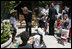 Mrs. Laura Bush talks with a little boy at Projecto Aprendiz Friday, March 9, 2007, in Sao Paulo, Brazil. White House photo by Shealah Craighead