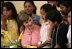 Mrs. Laura Bush talks to children at Camino Seguro (Safe Passage) in Guatemala City, Guatemala, Monday, March 12, 2007. White House photo by Eric Draper