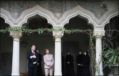 Mrs. Laura Bush listens Friday, April 4, 2008, as Dr. Petre Radu Guran explains the finer details of the Stavropoleos Church in Bucharest. Dr. Guran, an expert in Byzantine Culture and Society, is a senior researcher at the Institute for South-East European Studies at the Romanian Academy of Sciences.