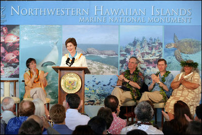 Mrs. Laura Bush is applauded by Hawaiian Gov. Linda Lingle, left, at the Northwest Hawaiian Islands Marine National Monument Naming Ceremony, Friday, March 2, 2007 in Honolulu, where Laura Bush unveiled the new Hawaiian name as the Papahanaumokuakea Marine National Monument. The Northwestern Monument represents the largest single conservation area in our nation's history and the largest protected marine area in the world. White House photo by Shealah Craighead 