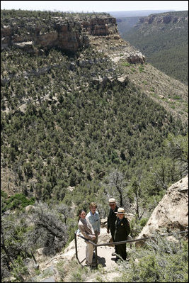 Mrs. Laura Bush pauses for a photo while hiking in Mesa Verde National Park in Colorado with, from left, Lynn Scarlett, Acting Secretary of the U.S. Department of Interior, Fran Mainella, Director, National Park Service and Larry Wiese, Superintendent of Mesa Verde National Park on Tuesday, May 23, 2006. Mesa Verde, founded as a national park on June 29, 1906, is celebrating its Centennial Anniversary this year. White House photo by Shealah Craighead 