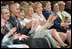 Mrs. Laura Bush, joined by, from left, Robert D. Coombe, Ph.D., Chancellor, University of Denver, Jordan Suniga, Student, Grace Keirnes, Student, and Lt. Governor Jane E. Norton, Lt. Governor of Colorado, attends the second regional Helping America's Youth Conference on Friday, August 4, 2006, in Denver, Colorado. According to the Department of Defense there are approximately 189, 000 children of deployed parents nationwide. White House photo by Shealah Craighead 