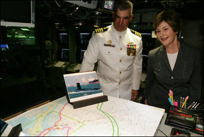 Mrs. Laura Bush and Captain John Litherland, Commanding Officer of the USS Texas, pause in the control room of the submarine during a tour of the ship Saturday, September 9, 2006, in Galveston, Texas. Mrs. Bush later participated in the Commissioning Ceremony marking the entry of the vessel into the U.S. Atlantic Fleet. White House photo by Shealah Craighead 