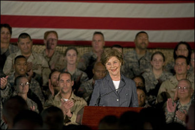 Mrs. Laura Bush addresses American troops Thursday, Oct. 25, 2007, at Ali Al Salem Air Base near Kuwait City. "With your courage and compassion, you show that the United States military is one of the greatest forces for good in the world," Mrs. Bush told the troops. "And I hope you know that we pray... for an end to the violence everywhere so that future generations can grow up in a world at peace -- a world that you shaped."