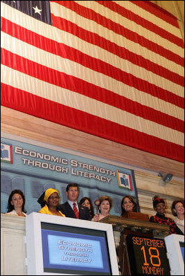 Mrs. Laura Bush raises the gavel signaling the close of trading Monday, Sept. 18, 2006, at the New York Stock Exchange. Mrs. Bush visited the Exchange to highlight literacy's role in extending benefits of free enterprise to individuals around the world. White House photo by Shealah Craighead 