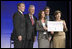 Mrs. Laura Bush announces a $60 million public-private partnership between the U.S. Government and the Case Foundation at President Bill Clinton's Annual Global Initiative Conference in New York Wednesday, September 20, 2006. With her, from left, are: Raymond Chambers, Chairman, MCJ and Amelier Foundations; former President Bill Clinton, and Jean Case and Steve Case, founders of the Case Foundation. The partnership will work to provide clean water by 2010 to up to 10 million people in sub-Sahara Africa, where a child dies every 15 seconds due to illnesses related to unsanitary drinking water. White House photo by Shealah Craighead 