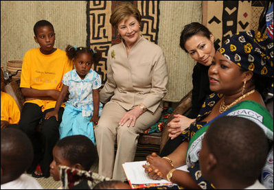 Mrs. Laura Bush joins a discussion with orphans and caretakers at the WAMA Foundation Sunday, Fab. 17, 2008 in Dar es Salaam, Tanzania, during a meeting to launch the National Plan of Action for Orphans and Vulnerable Children.