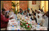 Mrs. Laura Bush and Mrs. Salma Kikwete sit at the head of the table during a roundtable Sunday, Feb. 17, 2008, in Dar es Salaam, with Madrasa graduates who have received HIV prevention education as part of their religious instruction. Madrasa training is comparable to the training students in the U.S. receive in Sunday school or Hebrew school.