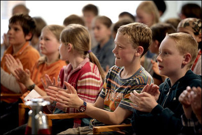 Children applaud after a speech by Mrs. Laura Bush at the ribbon cutting at the Opening of America @ Your Library at Schwerin City Library Wednesday, June 6, 2007 in Schwerin, Germany.