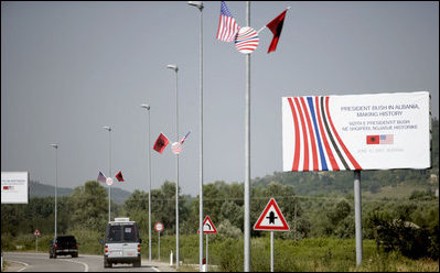 Welcome signs line the Presidential motorcade route Sunday, June 10, 2007, in Tirana, Albania.