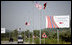 Welcome signs line the Presidential motorcade route Sunday, June 10, 2007, in Tirana, Albania.