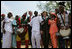 President George W. Bush and Mrs. Laura Bush stands with the Kankouran West African Dance Company after delivering remarks during a ceremony marking Malaria Awareness Day Wednesday, April 25, 2007, in the Rose Garden. "The American people, through their government, are working to end this epidemic,"said President Bush. "In 2005, President Bush announced the President's Malaria Initiative -- a five-year, $1.2 billion program to combat malaria in the hardest-hit African nations."