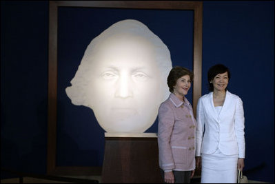 Mrs. Laura Bush and Mrs. Akie Abe, wife of Japanese Prime Minister Shinzo Abe, stand before a portrait of George Washington as they talk to members of the media, following a tour of the Mount Vernon Estate of George Washington Thursday, April 26, 2007, in Mount Vernon, Va.