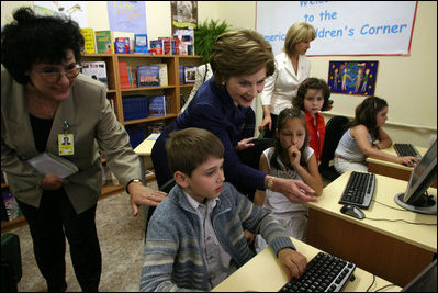 Mrs. Laura Bush joins youngsters at the opening of the American Children's Corner at Sofia City Library Monday, June 11, 2007, in Sofia. Mrs. Bush said, "The books in this American Corner tell the story of the United States, describing my country's history, culture and diverse society. In these books, children in Sofia can discover literature that children in the United States enjoy."