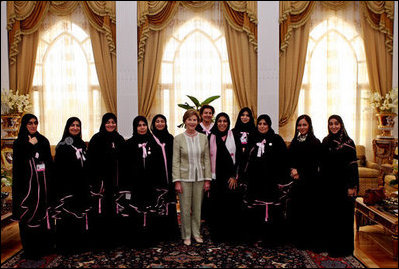 Mrs. Laura Bush pauses for a photo with guests upon conclusion of a social lunch with Sheikha Fatima Bin Mubarak at Sheikha Fatima's Sea Palace Monday, Oct. 22, 2007, in Abu Dhabi, United Arab Emirates. The visit to Abu Dhabi was the first during Mrs. Bush's weeklong visit to the Middle East, where she is scheduled to meet with key officials, medical and educational leaders, and leaders of women's groups.