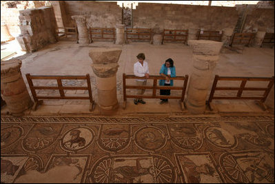 Mrs. Laura Bush tours the Petra Church with Dr. Barbara Porter, Director of the American Center for Oriental Research, during a walk through the ancient city that included homes, a temple, an amphitheater and royal tombs. The church was discovered in 1973 by an American archeologist. It's estimated that the church was built in the fifth century and included three apses. The mosaic tile covered both church's side aisles.