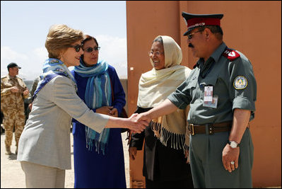 Governor Habiba Sarabi, center, introduces Mrs. Laura Bush to Col. Hafizullah Paymon, Commander of the Afghan Regional Training Center, during a visit to the Police Training Academy in Bamiyan, Afghanistan there Sunday, June 8, 2008.