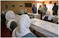 Mrs. Laura Bush and Governor Habiba Sarabi, in white, meet with female police trainees who will graduate June 15th from Non-Commissioned Officer Training during a visit Sunday, June 8, 2008, to the Police Training Academy in Bamiyan, Afghanistan.