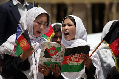 Students sing as they welcome Mrs. Laura Bush to the future site of the Ayenda Learning Center Sunday, June 8, 2008, in Bamiyan, Afghanistan.