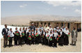 Mrs. Laura Bush is joined by Habiba Sarabi, Governor of Bamiran Province, right, and students of the Ayenda Learning Center Sunday, June 8, 2008, during a tour of the school's construction site in Bamiyan, Afghanistan.