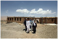 Mrs. Laura Bush is joined by Governor of Bamiran Province, Habiba Sarabi, right, and students, during a tour of the future site of the Ayenda Learning Center Sunday, June 8, 2008, in Bamiyan, Afghanistan.The tour was led by Ihsan Ullah Bayat, far left. Once completed, the Ayenda Learning Center will provide a safe and nurturing environment for 128 of Bamiyan most disadvantaged children to live. At the same time, it will provide educational opportunities for as many as 210 children in the region.