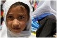 A young girl is seen outside of the Ayenda Learning Center during Mrs. Bush's visit Sunday, June 8, 2008, in Bamiyan, Afghanistan.